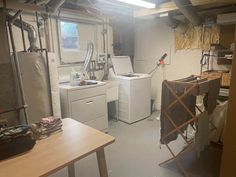 Basement has laundry room, storage and utilities. - 9707 Bristol Ave