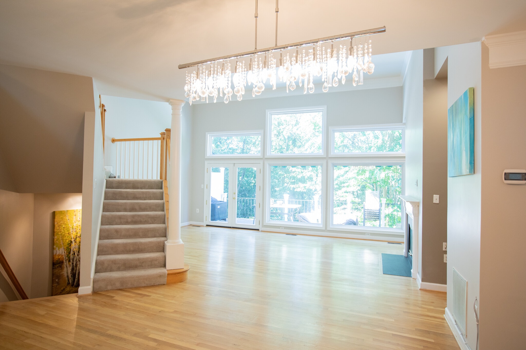 Bright floor to high ceiling picture windows - 4006 Dogberry Ln