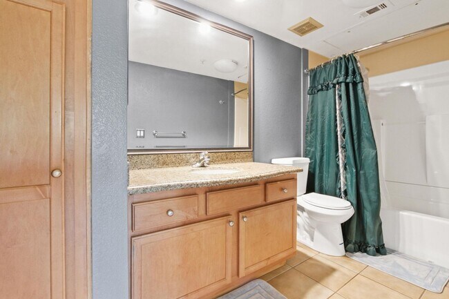 Building Photo - 1BR Condo with Private Balcony, Central A/C & Community Amenities in Corona