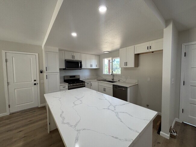 Building Photo - Fully remodeled home nestled on a spacious...