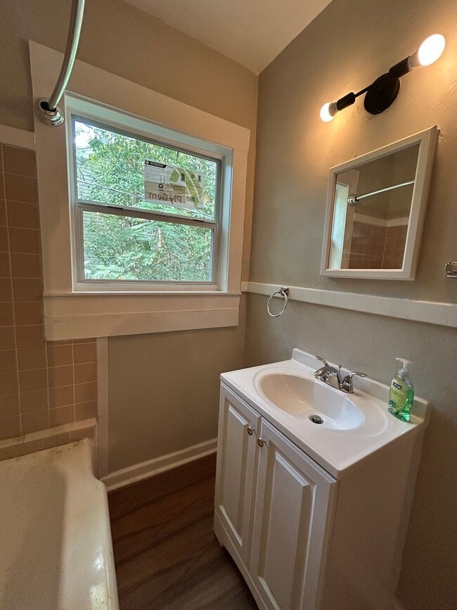 Building Photo - Freshly Painted 2x1 with Brand-New Plank Floors