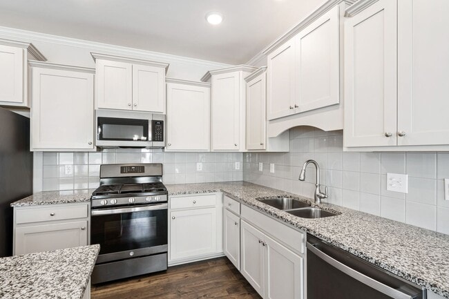 Building Photo - Stylish 4-Bedroom Townhome with Backyard O...