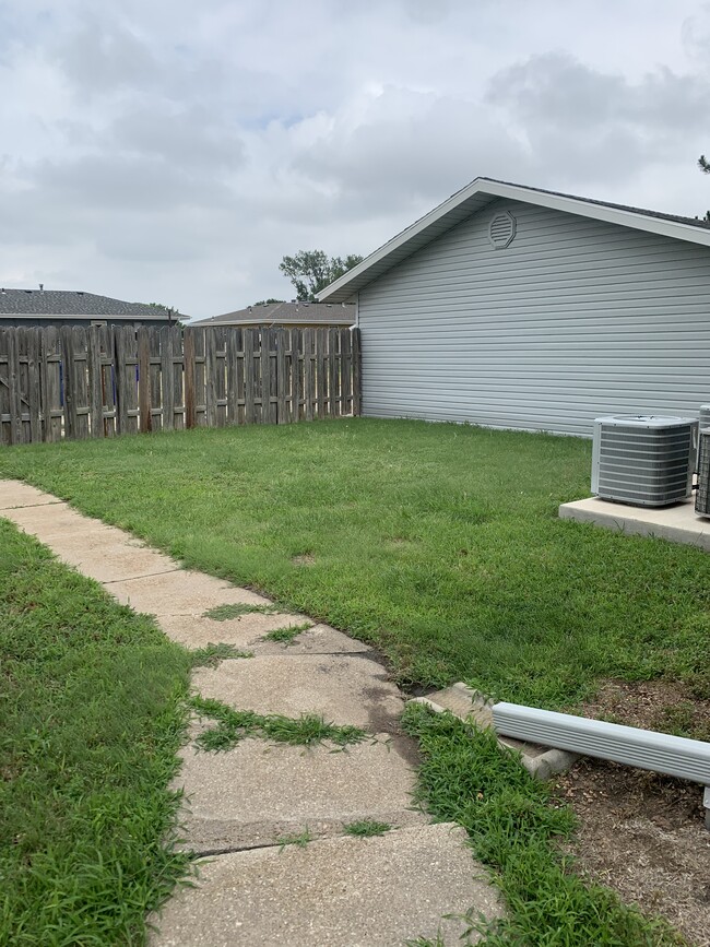 Fenced in backyard and patio - 513 W 36th St