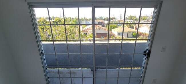 Master bedroom balcony view of neighborhood. - 14126 Tiara St