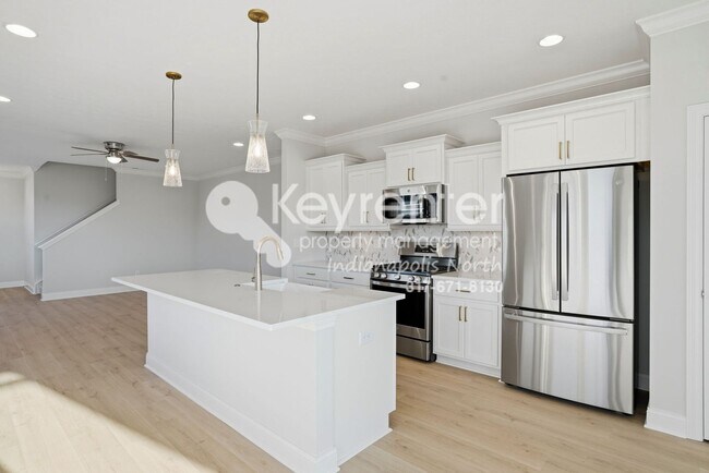 Building Photo - Located in Westfield, IN, this attractive 3-bedroom, 2.5-bath home sits on a corner lot within an...