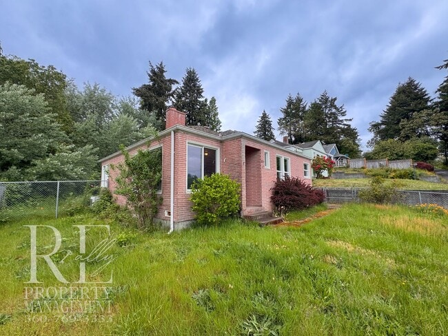 Building Photo - Timeless Charm Meets Comfort – 2-Bedroom Brick Home with Fireplace & Fenced Yard