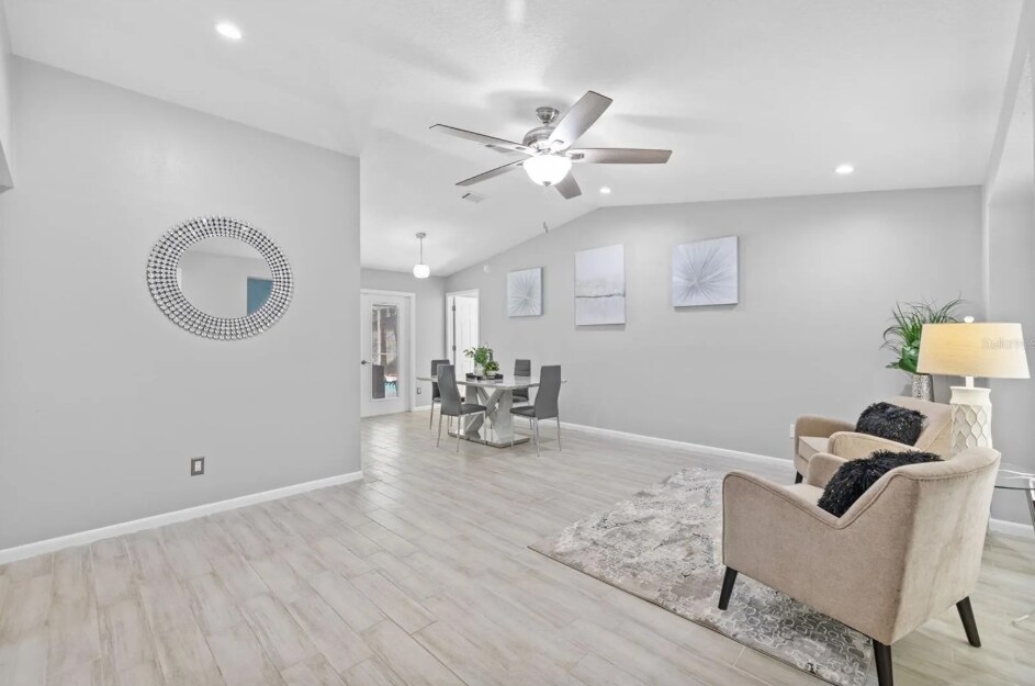 Elegant dining space with modern lighting and an open floor plan. - 1932 Brainerd Ct