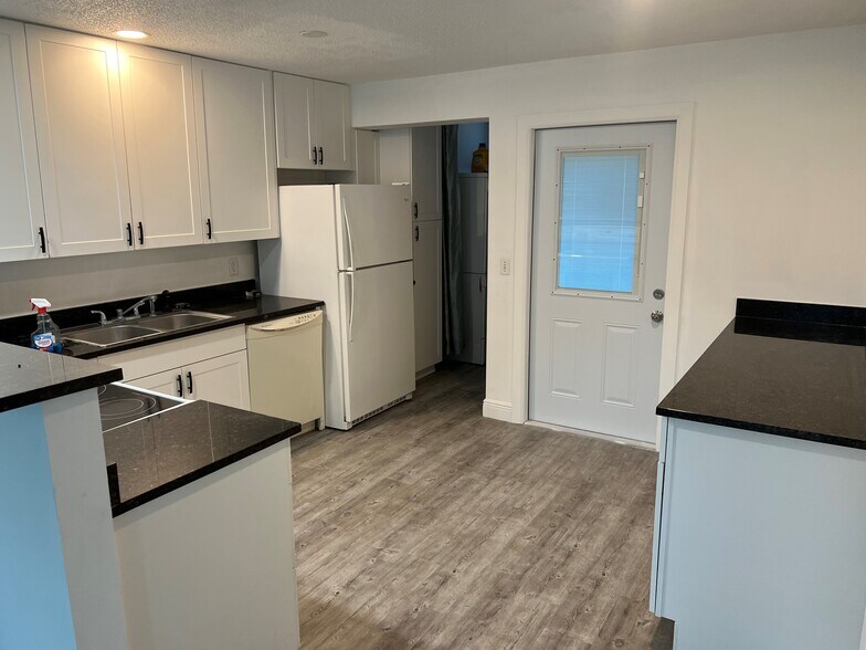 Kitchen, Laundry Pantry and Back Door - 2405 NE Rustic Plz