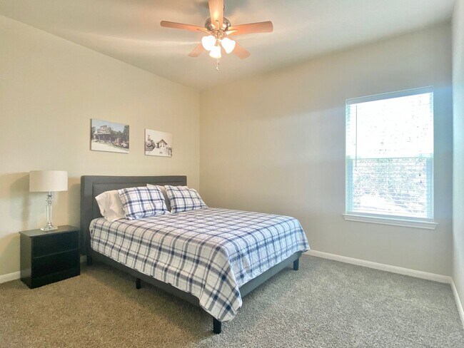 Building Photo - This charming two-story home, built in 2018, offers a spacious open floor plan perfect for casual...