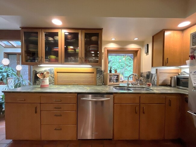 Building Photo - One-of-a-Kind Custom Home with Wall of Windows, Stone Fireplaces, Expansive Entertainment Space &...