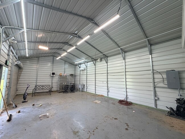 Building Photo - Large lot with Shop for boat or Atvs......