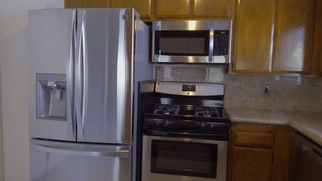 Kitchen with premium stainless appliances. - 26008 Alizia Canyon Dr