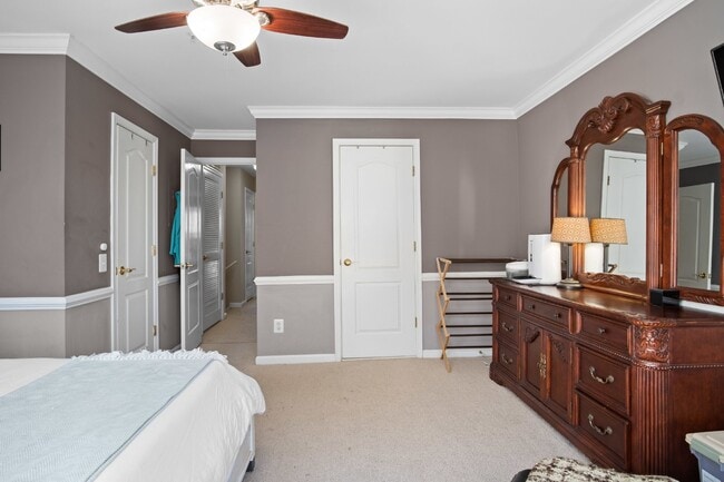 Building Photo - This inviting two-level townhome offers comfort and style, featuring gleaming hardwood floors on ...