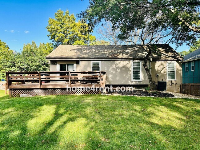 Building Photo - A Lovely Lenexa Home w/ Wood Floors Throughout, Updated Kitchen, Finished Basement and a Fenced Y...