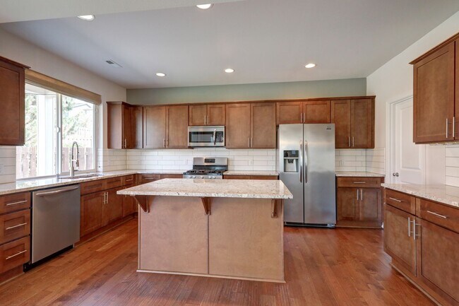 Building Photo - 4 Bedroom Home with Open Den, Living & Family Rooms – Space for Everyone