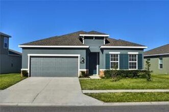 Building Photo - Open concept home offering four bedrooms, three baths, a two car garage and open lanai.