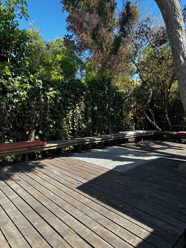 Entertain in the front yard with a large deck & built in benches. - 924 Nowita Pl