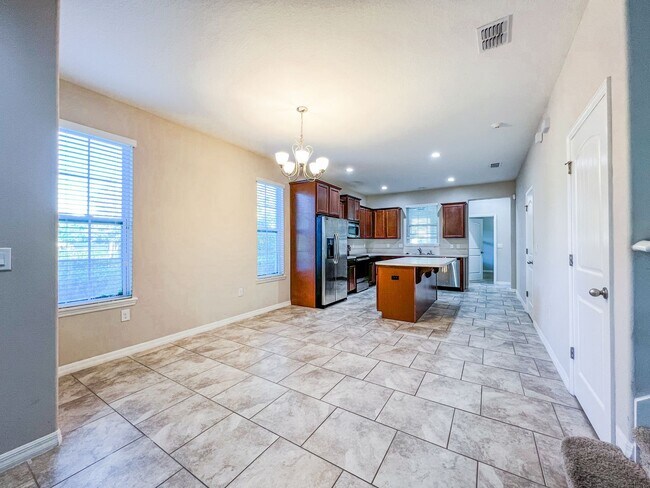 Building Photo - Spacious 4-Bedroom Townhome in Harmony – A Perfect Blend of Nature & Comfort!