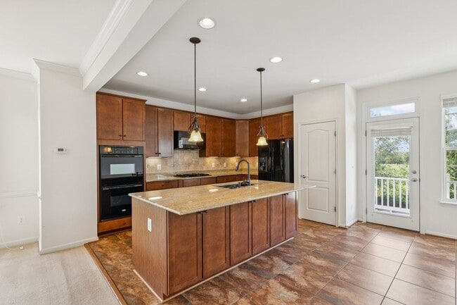 Building Photo - This beautifully maintained end-unit brick...