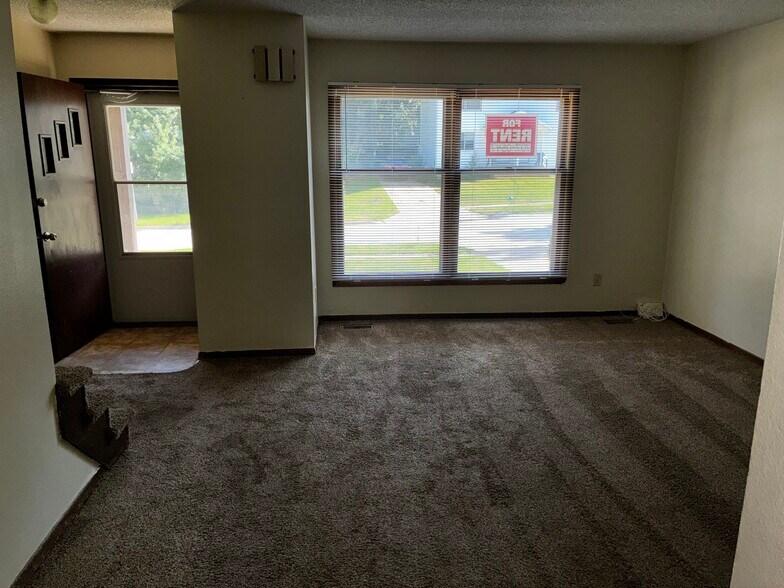 A nice view of the living room and front door. - 1205 Randolph St