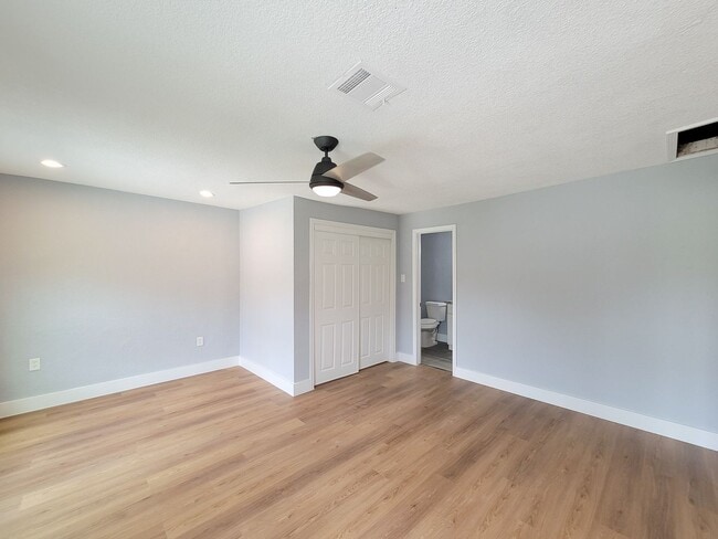 Building Photo - This beautifully updated 4-bedroom home is just under two miles from Highway 288 and Loop 610, ma...