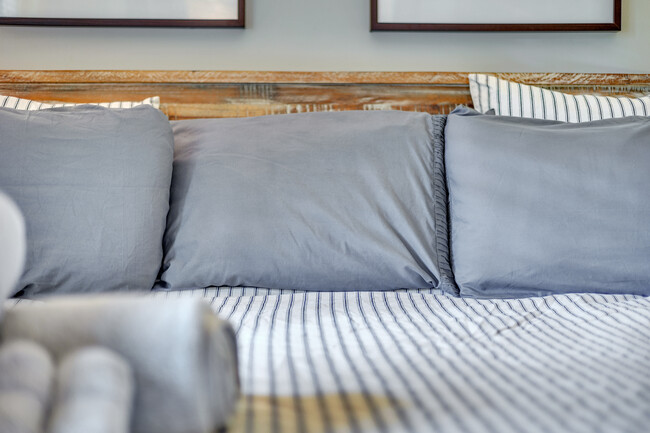 Master bedroom features a King-sized bed - 1876 DeKalb Ave NE