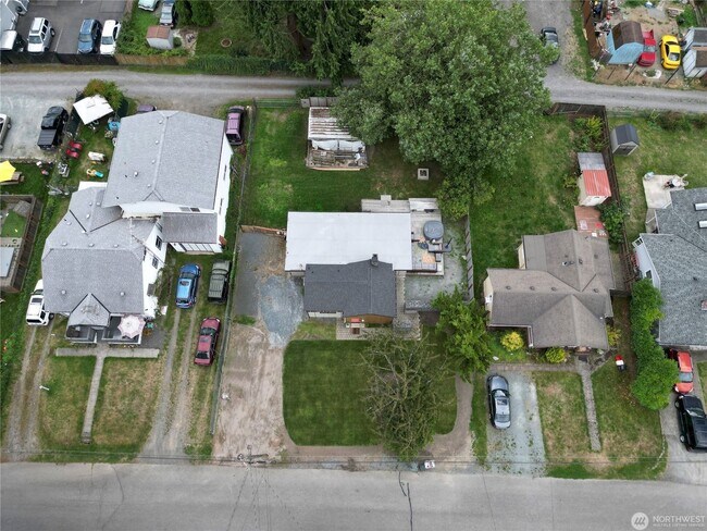 Building Photo - Remodeled 3 bdrm home on a large lot with 500 sq ft wrap around deck!