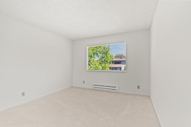 Building Photo - Modern 2-Bedroom Condo with Pool and Koi Pond Views