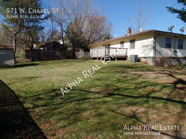 Building Photo - Pet friendly home with level fenced back y...