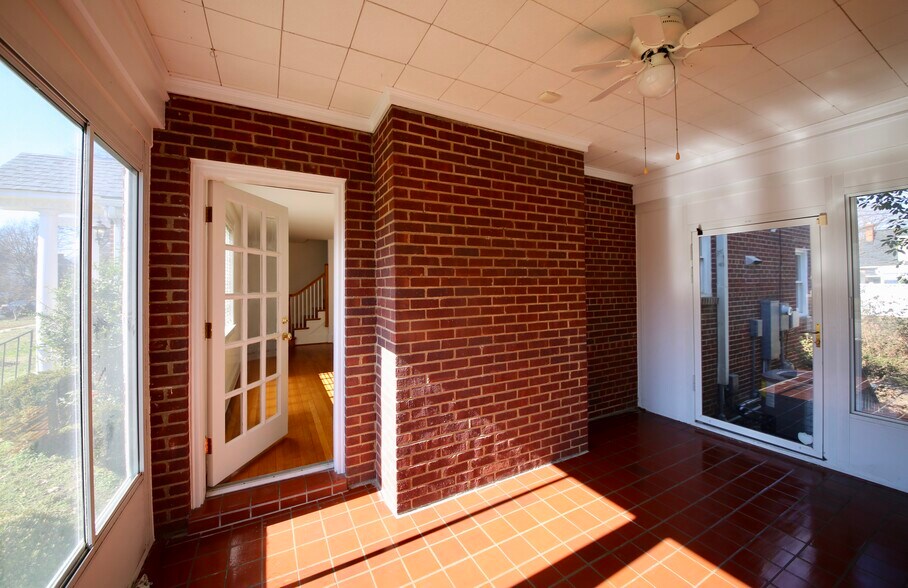 Sunny enclosed side porch - 2308 Buckingham Ave