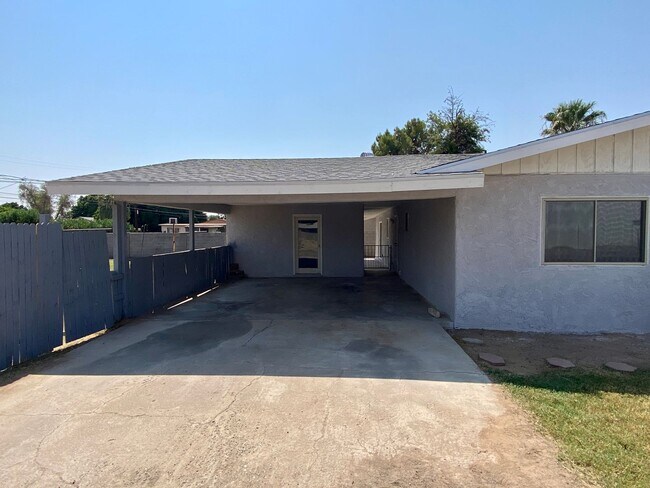 Building Photo - 3 bedroom home with large living room on a large corner lot with lots of room for play.
