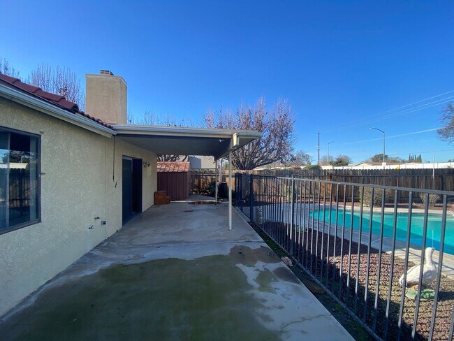 Building Photo - Get ready for Summer in this 3 BD 2 BA SW home with a Pool on a corner lot