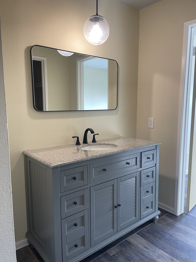 vanity and mirror - 685 Dartmore Ln