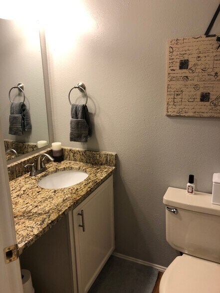 half-bath downstairs with new granite counters. - 9915 NE 124th St
