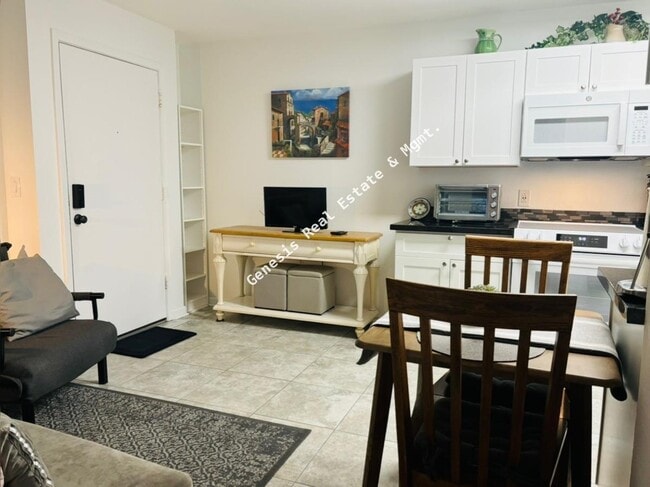 Building Photo - "Chic & Cozy 1-Bedroom Condo with Granite ...