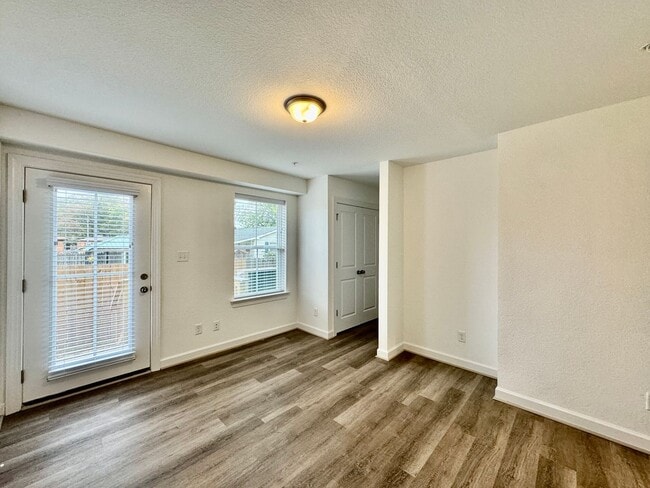 Building Photo - Practically New & Available NOW! Americana Luxury Townhomes! Pet Friendly! Attached Garage! All A...