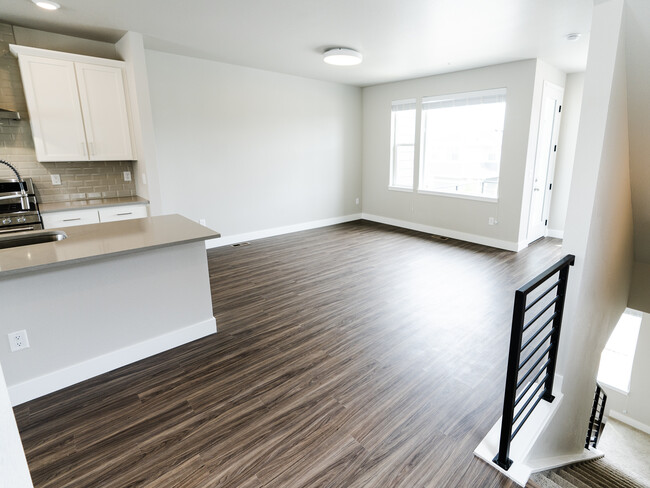 Kitchen and living area, taken from the half-bath doorway - 2863 W 69th Ave