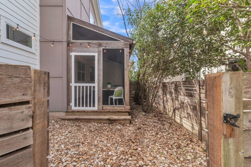 View of screened porch from back yard - 402 Irma Dr
