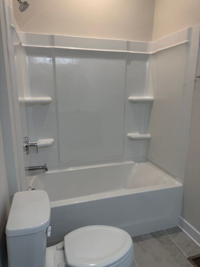 Building Photo - Brand New 3-Story Townhome with 2-Car Gara...