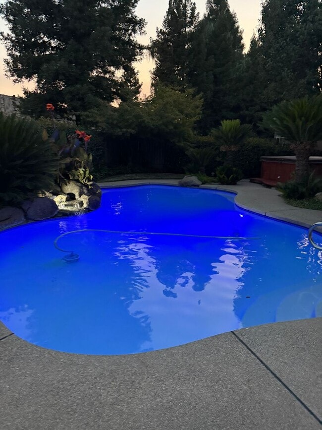 Building Photo - Wonderful 4 bedroom home in Clovis offering a pool, spa, 3 car garage, potential RV and or boat s...