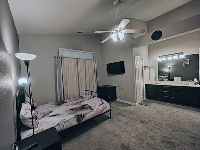 Master Bedroom with double Sink & large sliding door to Outdoor Patio - 9316 Caulfield Dr