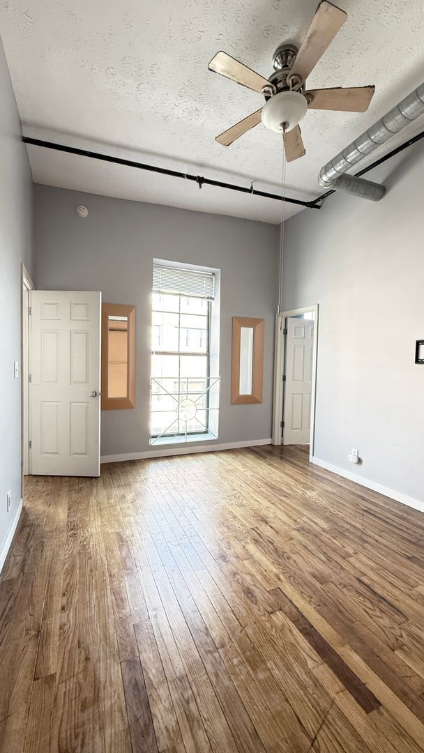 Building Photo - UPSCALE DOWNTOWN CONDO