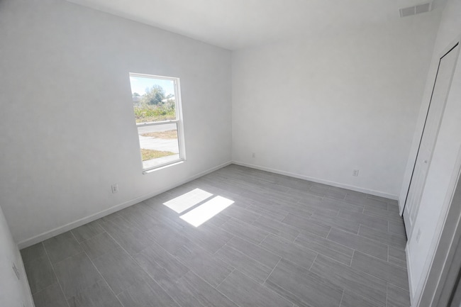 Building Photo - STUNNING NEW 3BR/2BA HOME WITH GARAGE -IN PRIME SW LEHIGH ACRES LOCATION