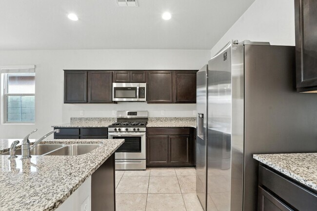 Building Photo - Rare Find! Spacious 3-Bed, 2-Bath + 3-Car ...