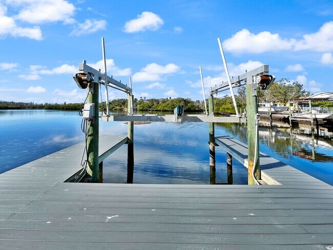 Building Photo - 4 Bed Waterfront Paradise with Pool, Dock & Gulf Access in Baileys Bluff
