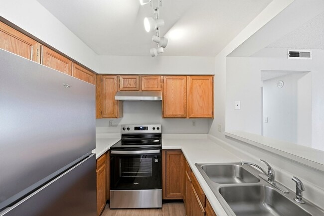 Building Photo - Charming 2 Bedroom Second Story Condo with easy access to everything!