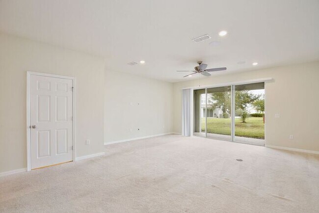 Building Photo - Immaculate Townhome · Dual En-Suite Bedrooms + Flex Loft · Cable & Internet Included · 3.5 Miles ...
