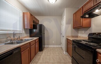 Building Photo - Welcome to this spacious 4-bedroom, 2.5-ba...
