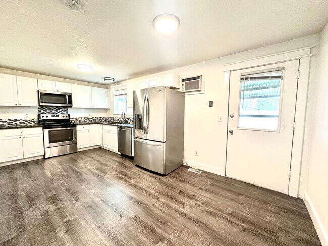 Building Photo - Three bedroom home with large fenced yard