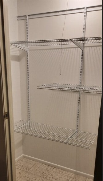 Storage closet with adjustable shelving, located next to the front door - 434 Clinton Pl